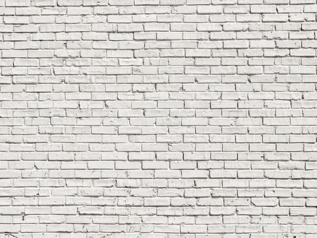 Fototapeta przedstawiająca białą ceglaną ścianę z wyraźną strukturą i białymi spoinami.