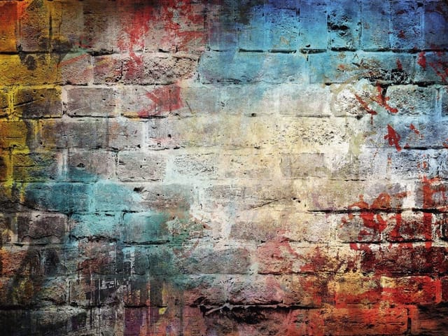 Fototapeta Ceglana ściana z kolorowymi plamami