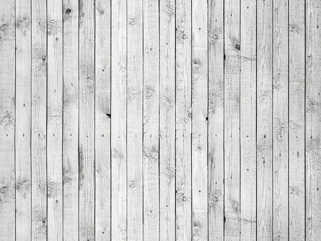 Fototapeta z jasnymi drewnianymi deskami ułożonymi pionowo, z widocznymi słojami