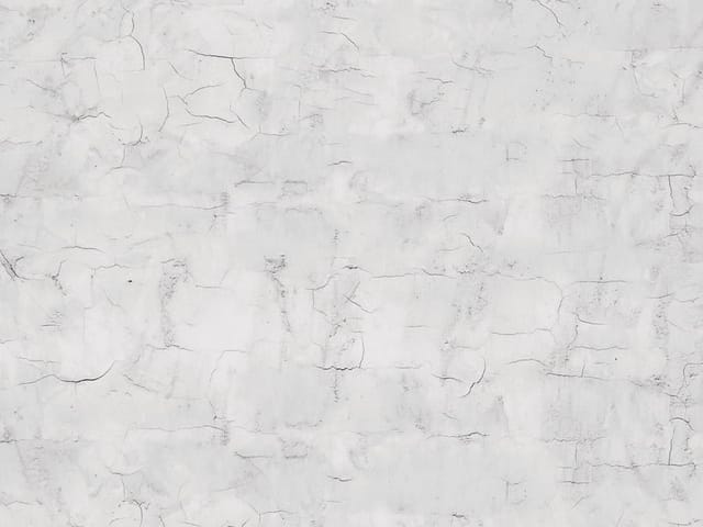 Fototapeta Tekstura Popękanej Ściany (kod: 14602) Fototapeta przedstawiająca teksturę popękanej ściany w jasnych odcieniach szarości