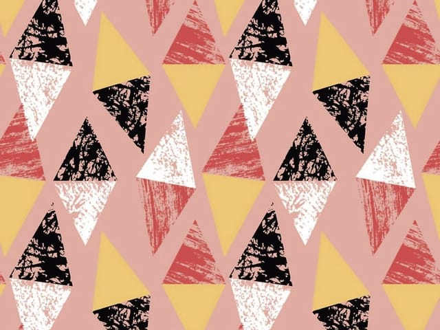 Fototapeta z geometrycznymi wzorami trójkątów w różnych kolorach na różowym tle