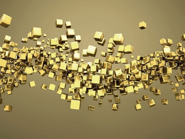 Fototapeta z unoszącymi się złotymi sześcianami na złotym tle