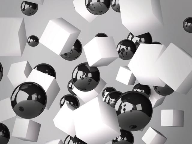 Fototapeta z białymi sześcianami i czarnymi kulami na szarym tle