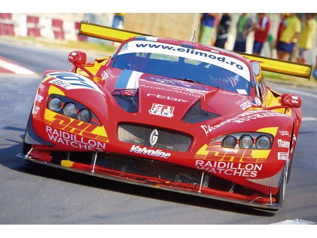 Fototapeta Czerwony wyścigowy na torze (kod: 1874) Fototapeta Czerwony wyścigowy na torze