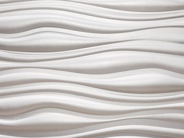 Fototapeta z falistymi wzorami tworzącymi trójwymiarowy efekt na ścianie