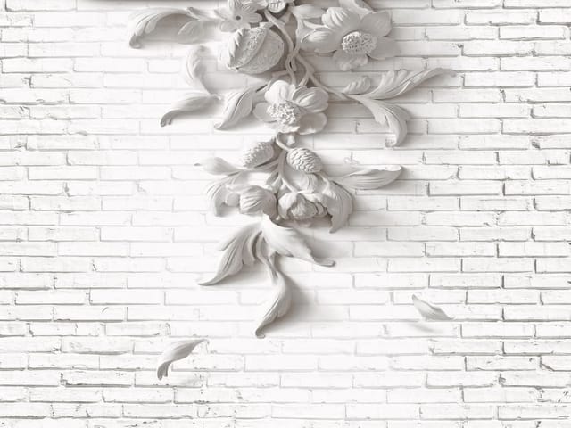 Fototapeta z dekoracyjnym wzorem kwiatowym na białej ceglanej ścianie