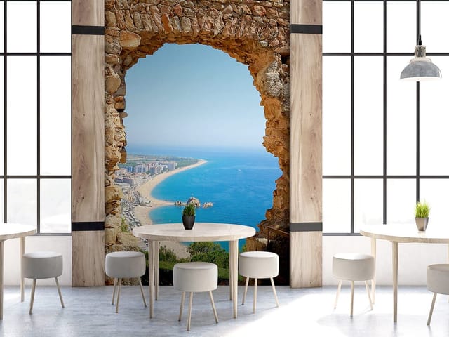Fototapeta Widok na plażę przez kamienny łuk (kod: 2265) Fototapeta Widok na plażę przez kamienny łuk