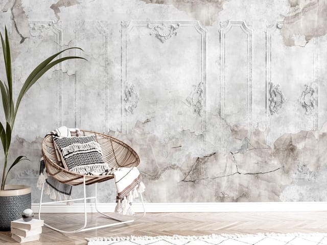 Fototapeta przedstawiająca starą, zniszczoną ścianę z ornamentami i pęknięciami