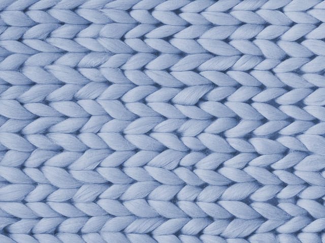 Fototapeta Struktura Grubego Splotu Włóczki (kod: 25822) Fototapeta z grubym splotem włóczki w jasnoniebieskim kolorze