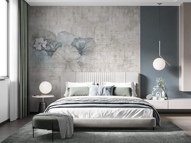 Fototapeta z liliami i dużymi liśćmi na tle przypominającym mur