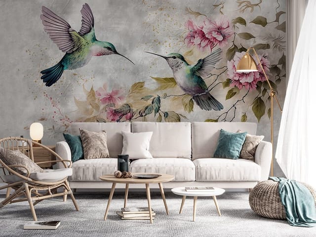 Fototapeta z dwoma kolibrami w locie, otoczonymi kwiatami i liśćmi