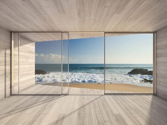 Fototapeta z widokiem na ocean przez szklane drzwi i plażę