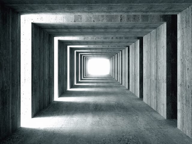 Fototapeta przedstawiająca betonowy tunel z geometrycznymi kształtami