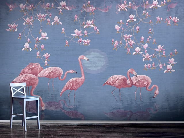 Fototapeta z flamingami na tle kwitnących magnolii i niebieskiego nieba