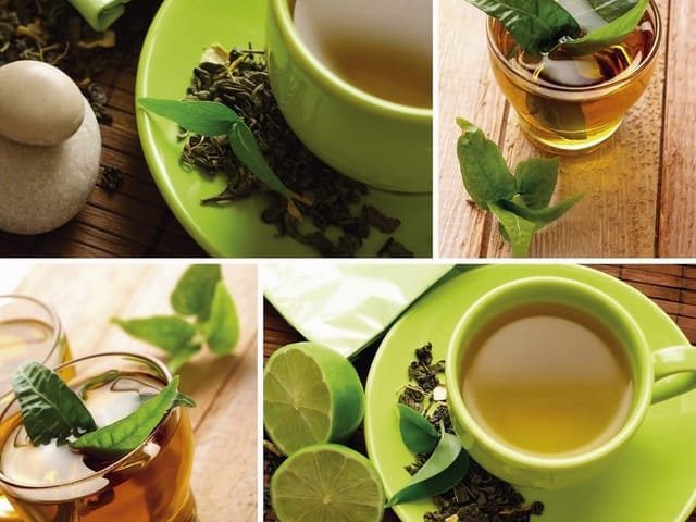 Fototapeta przedstawiająca zielone filiżanki z herbatą na drewnianym stole