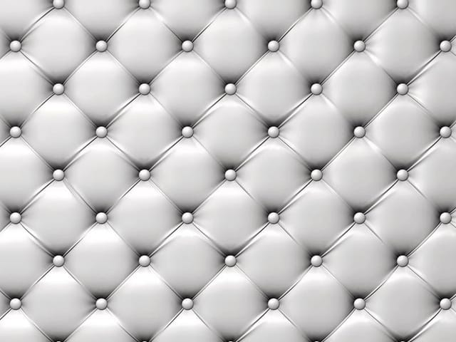 Fototapeta z pikowaną powierzchnią i regularnymi guzikami w jasnych barwach