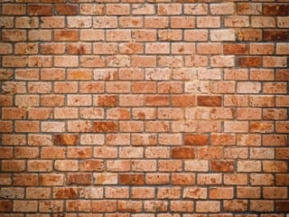 Fototapeta Ceglana ściana w odcieniach czerwieni