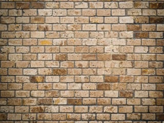 Fototapeta Ściana z cegieł w brązowych odcieniach