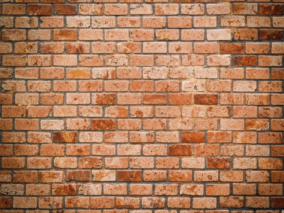 Fototapeta Ceglana ściana w odcieniach czerwieni