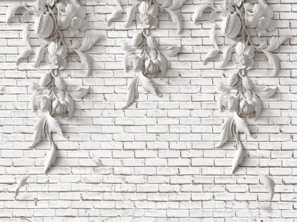 Fototapeta Reliefy kwiatowe na ceglanej ścianie