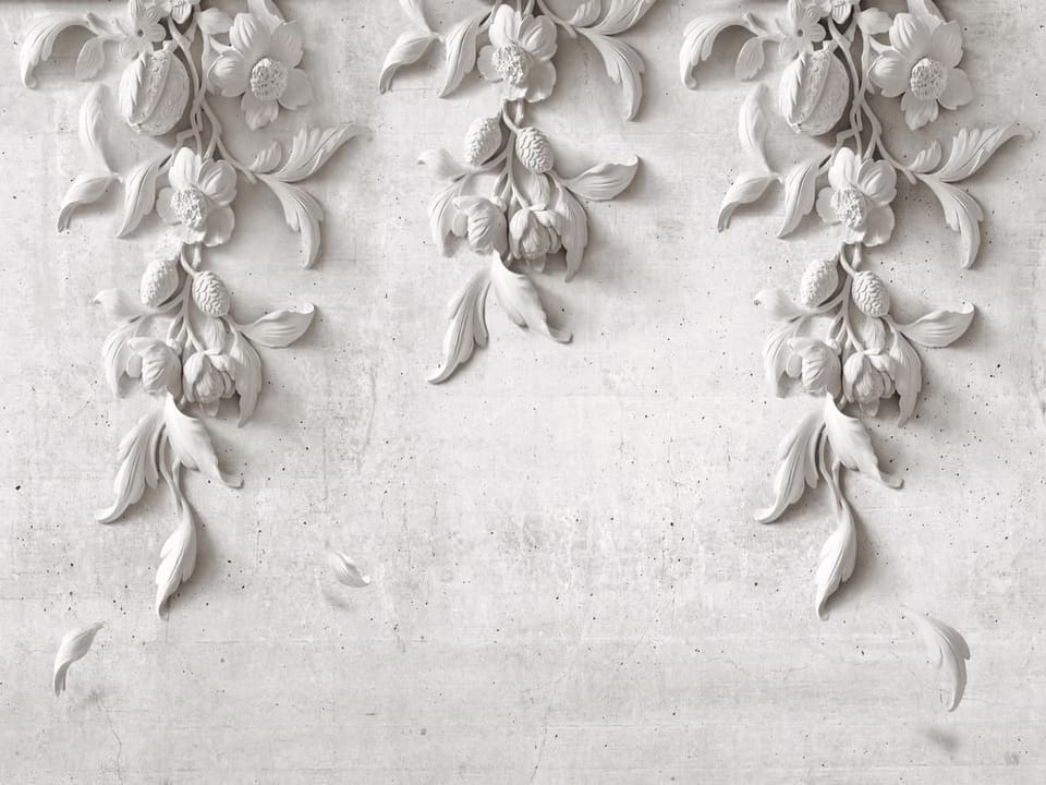 Fototapeta Reliefy kwiatowe na jasnej ścianie
