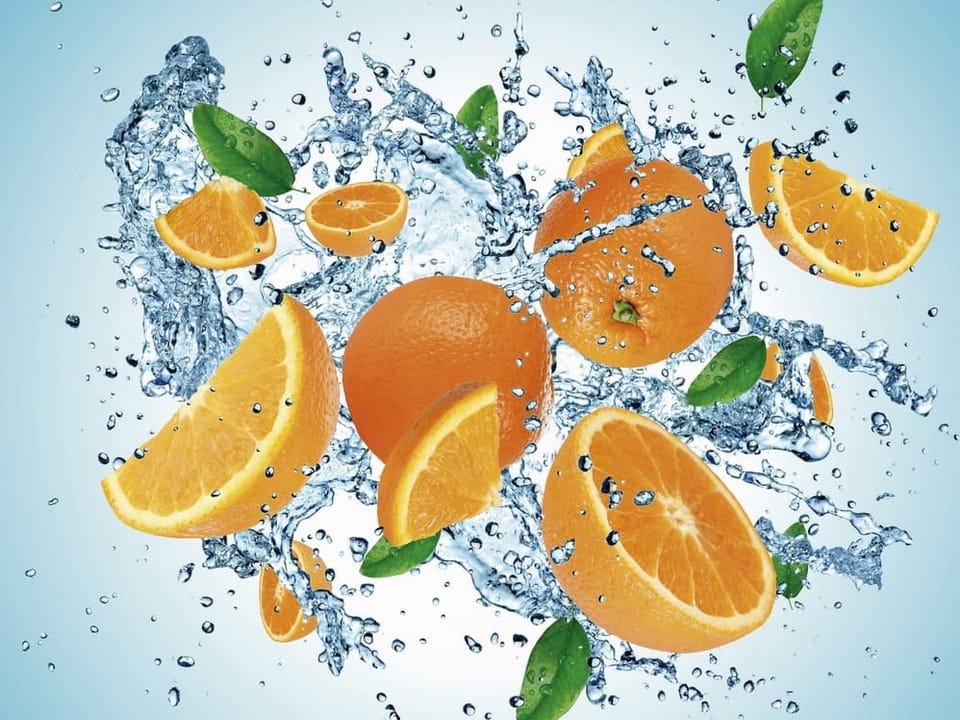 Fototapeta Pomarańcze w rozprysku wody