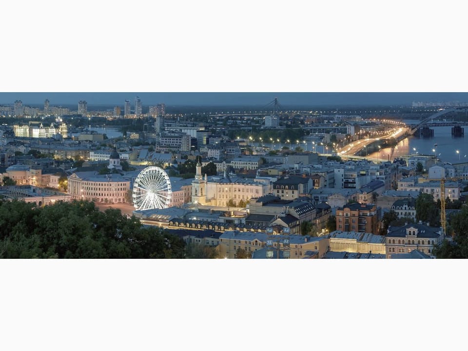 Fototapeta Panorama miasta z diabelskim młynem