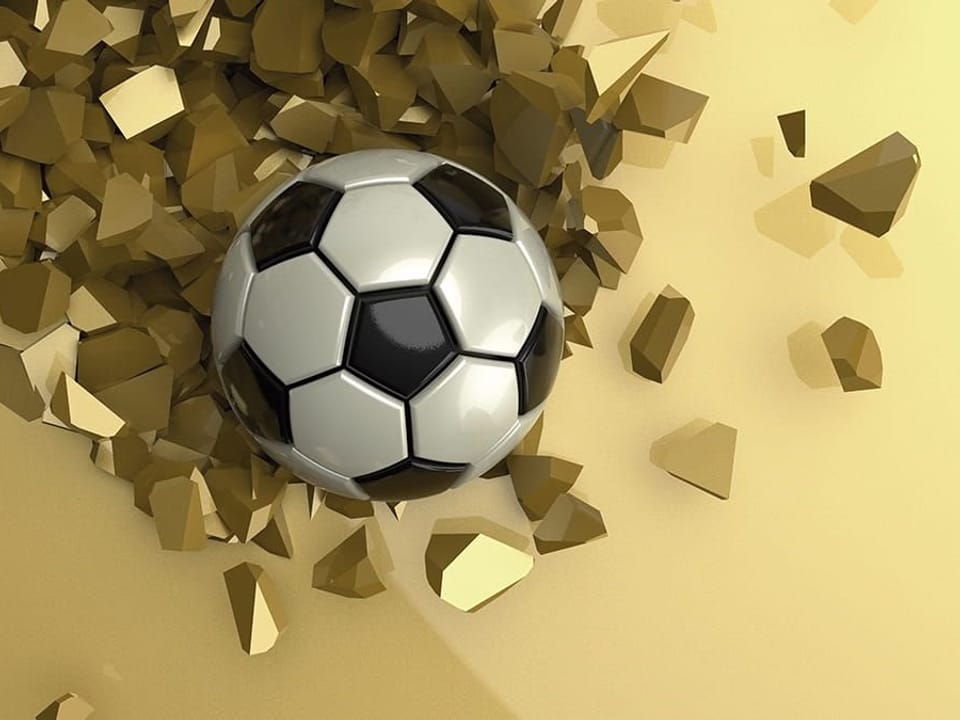 Fototapeta Piłka nożna w złotych odłamkach