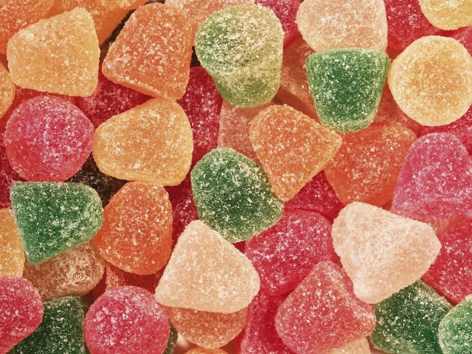 Fototapeta Kolorowe żelki z cukrową posypką