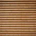 Miniatura fototapety Drewniana ściana z poziomych bali