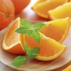 Miniatura fototapety Pomarańcze na drewnianym talerzu