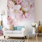 Miniatura fototapety Gałązka kwitnącej wiśni Sakura we wnętrzu salonu