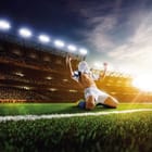 Miniatura fototapety Piłkarz na kolanach na stadionie