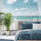 Miniatura fototapety Roślina na tarasie z widokiem na morze we wnętrzu sypialni