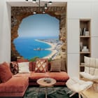Miniatura fototapety Widok na plażę przez kamienny łuk we wnętrzu salonu