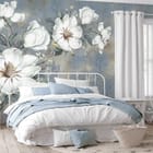 Miniatura fototapety Magnolie na gałęzi z zielonymi liśćmi we wnętrzu sypialni