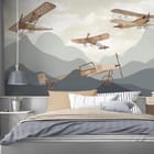 Miniatura fototapety Stare samoloty nad górami we wnętrzu pokoju nastolatka