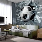 Miniatura fototapety Piłka nożna w ruchu przez szkło we wnętrzu pokoju nastolatka