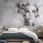 Miniatura fototapety Kobieta z kwiatami w szarościach we wnętrzu sypialni