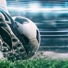 Miniatura fototapety But piłkarski w akcji na trawie