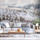 Miniatura fototapety Śnieżny las i góry w tle we wnętrzu salonu