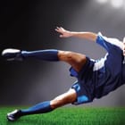 Miniatura fototapety Piłkarz na murawie w akcji