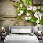 Miniatura fototapety Gałązka z Kwiatami na Drewnie we wnętrzu sypialni