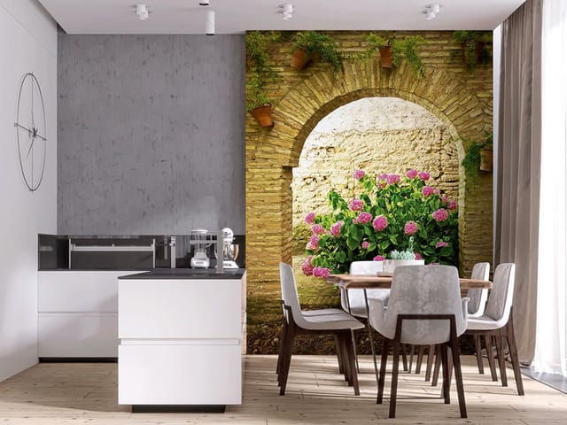 Fototapeta z krzewem hortensji pod kamiennym łukiem i ceglaną ścianą