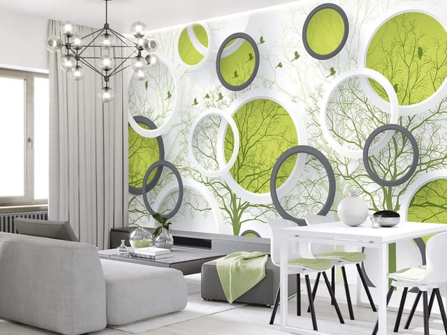 Fototapeta z abstrakcyjnymi okręgami i zielonymi wnętrzami na tle gałęzi drzew.