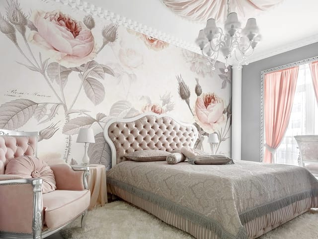 Fototapeta z różowymi kwiatami róży na gałązkach z delikatnymi liśćmi