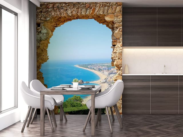 Fototapeta Widok na plażę przez kamienny łuk