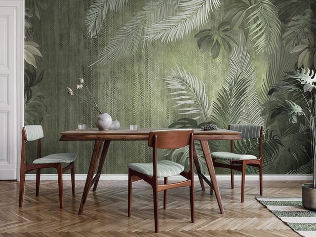 Fototapeta z dużymi liśćmi tropikalnych roślin na zielonym tle