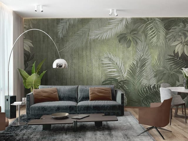 Fototapeta z dużymi liśćmi tropikalnych roślin na zielonym tle