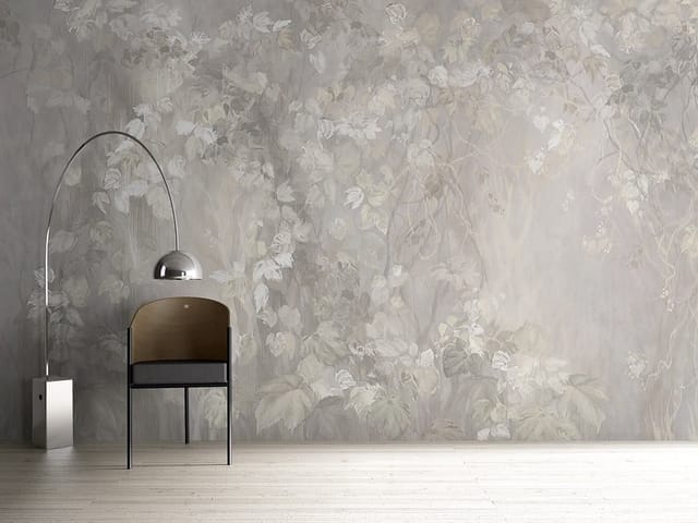 Fototapeta z delikatnymi liśćmi na gałęziach i jasnym tle